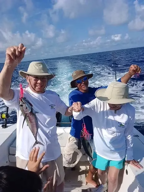 Happy anglers with double Black Fin Tuna, deep sea fishing Roatan, private boat charter, Caribbean adventure, Dos Reyes Roatan
