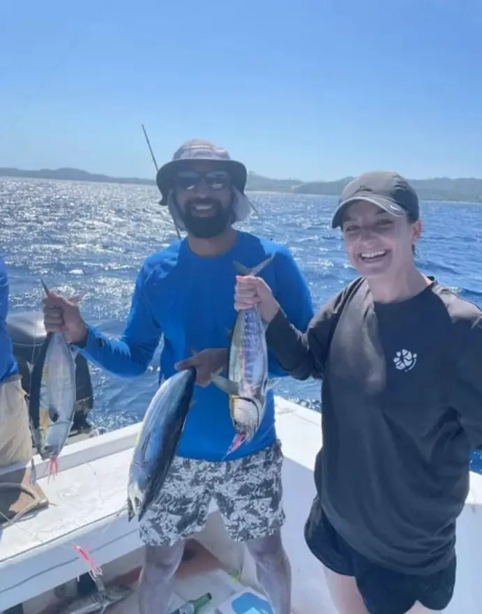 Couple holding triple Black Fin Tuna, deep sea fishing Roatan, private boat charter, Caribbean adventure, Dos Reyes Roatan