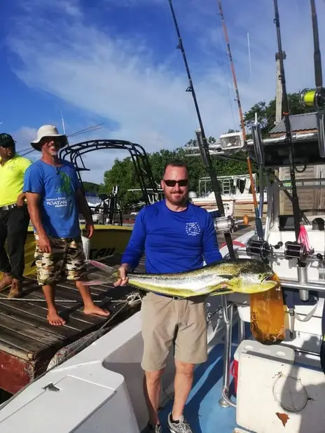 Chip and First Mate Eddie holding Mahi Mahi, deep sea fishing Roatan, private boat charter, Caribbean adventure, Dos Reyes Roatan