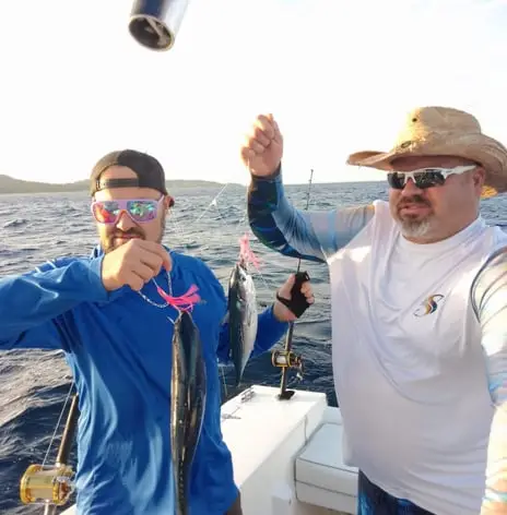 Fishing buddies holding double Black Fin Tuna, deep sea fishing Roatan, private boat charter, Caribbean adventure, Dos Reyes Roatan