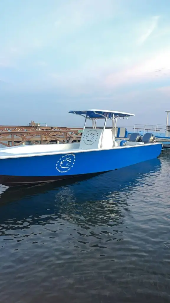 Dos Reyes Roatan Charter boat ready to depart from the dock — private fishing, snorkeling, and island tour charter in Roatan, Honduras