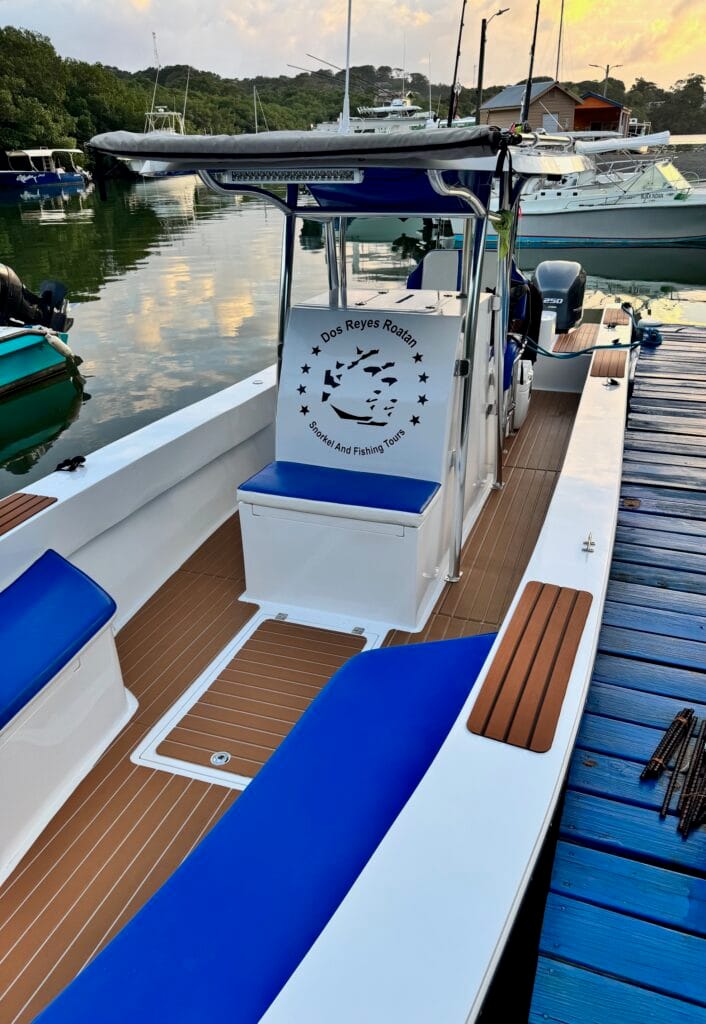 #1 Private Roatan boat charter Dos Reyes Teak flooring on Dos Reyes Roatan Charter boat — elegant marine deck design for luxury Caribbean excursions