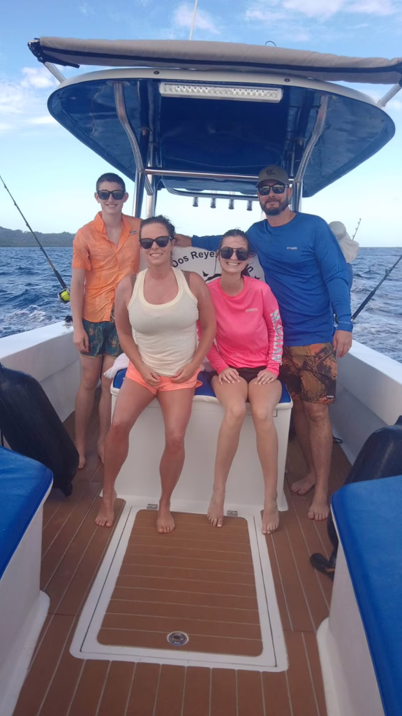 #1 Private Boat Charter in Roatan - Smiling family enjoying a private boat tour with Dos Reyes Roatan Charter — unforgettable snorkeling, fishing, and island adventures in Roatan, Honduras