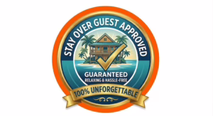 A circular gold and teal-blue "Stay Over Guest Approved" badge featuring a tropical resort island illustration, a checkmark, and banners guaranteeing "100% Unforgettable."