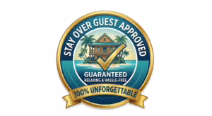 A circular gold and teal-blue "Stay Over Guest Approved" badge featuring a tropical resort island illustration, a checkmark, and banners guaranteeing "100% Unforgettable."